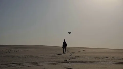 Man in the desert and copter Stock Footage 80093832