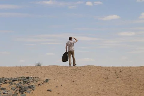 Man in desert Stock Photos
