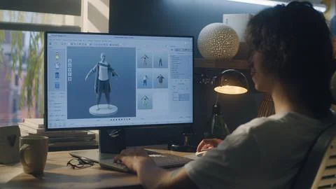 Man designing clothes in 3D modeling program Stock Photos