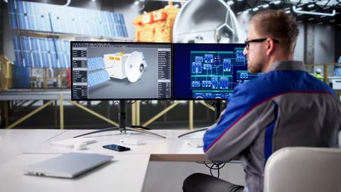 Man Designing Satellite With Solar Panels Using CAD Software Stock Footage 328403786