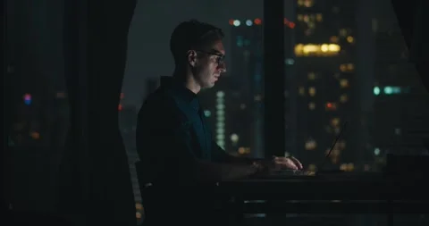Man designing technical diagrams at midnight, engineer perfecting blueprint Stock Footage 312122419
