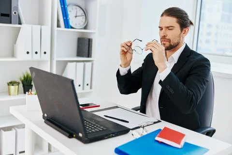 Man at the desk documents technology Stock Photos