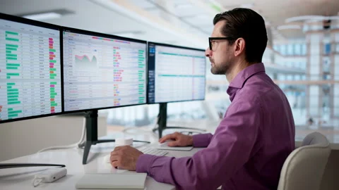 Man At Desk Reviewing Medical Coding Data Stock Footage 333846735
