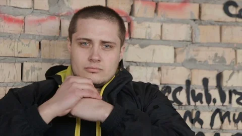 A man in despair on an abandoned building. full hd video Stock Footage 73579271