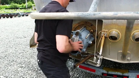 Man detaching a part from bottom section of boat Stock Footage 83182979