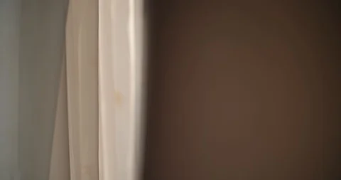 Man DETECTIVE using professional camera indoor to make photos shoot through the Stock Footage 88731444