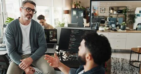 Man, developer and coding training in office for testing web application Stock Photos