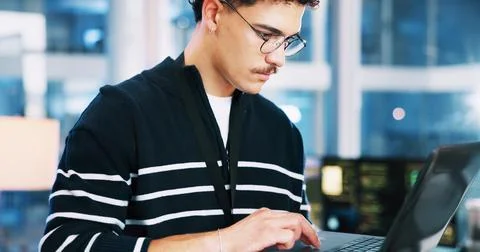 Man, developer and typing on laptop in office for programming, coding software Foto stock