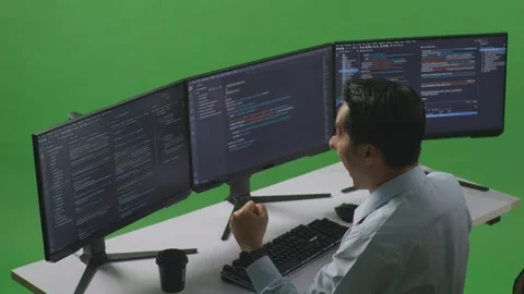 Man Developer Celebrating While Write Code With Multiple Computer Screens Stock Footage 249635075