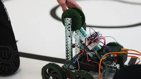 Man developer checks wires system in robot during testing Stock Footage 273031939