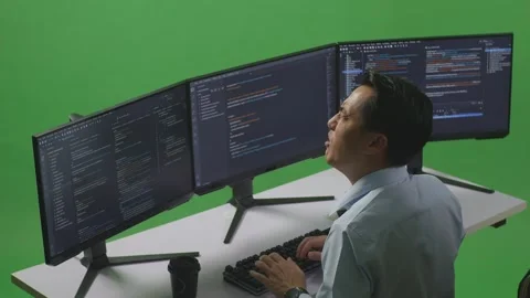 Man Developer Having Backache While Write Code With Multiple Computer Screens Stock Footage 249635676