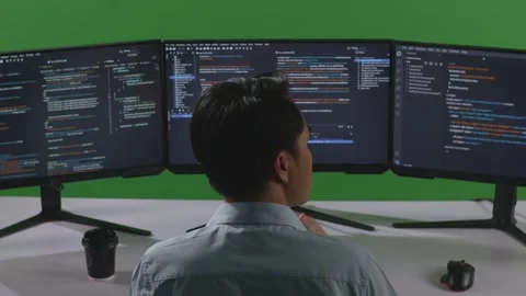 Man Developer Something His Index Finger Write Code With Multiple Computer Stock Footage 249632996