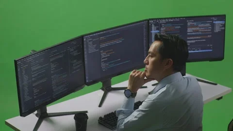 Man Developer Thinking About Something Write Code With Multiple Computer Stock Footage 249635540