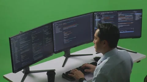 Man Developer Thinking Raising Index Finger Write Code With Multiple Computer Stock Footage 249635599