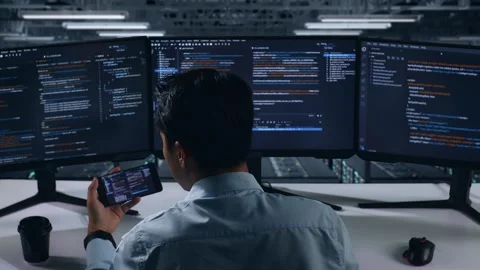 Man Developer Working With Mobile Phone While Write Code In Data Center Vídeos de archivo 270227155