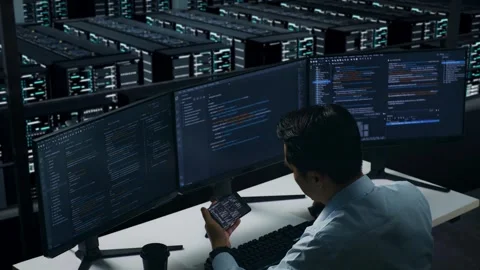 Man Developer Working With Mobile Phone While Write Code In Data Center Stock Footage 270228585