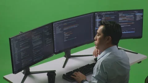 Man Developer Write Code With Multiple Computer Screens In Green Screen Studio Stock Footage 249635773