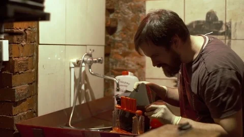 Man developing photos Stock Footage 72101485