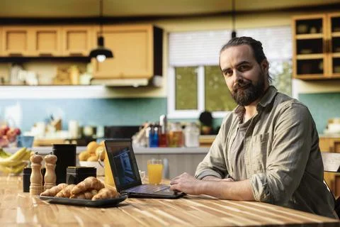 Man developing video game by testing gameplay mechanics and user interface Stock Photos