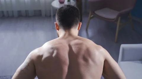 Man develops back muscles using equipment at home. 스톡 동영상 232278550