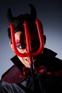 Man in devil costume in halloween concept Foto stock