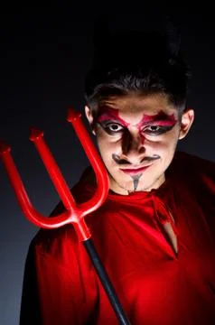 Man in devil costume in halloween concept 스톡 사진