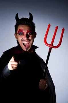 Man in devil costume in halloween concept Foto stock