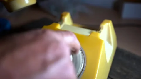 Man dialing 112 on old , aged , vintage rotary telephone Stock Footage 314280423