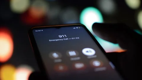 Man dialing 911 emergency numer on his phone in a defocused background Stock-Footage 171139198