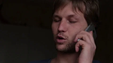 Man dialing phone number and calling on smartphone at home Video stock 76116398