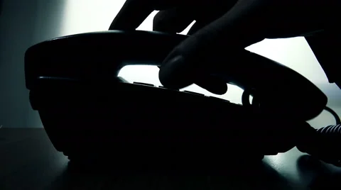 Man dialing phone number in silhouette Stock Footage 46941538