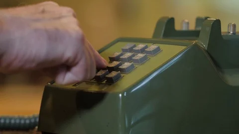 Man dialing retro push button rotary dial telephone. Stock Footage 118990846