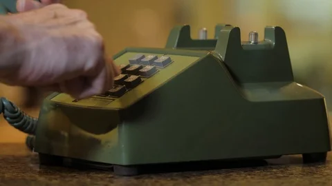 Man dialing retro push button rotary dial telephone. Stock Footage 118990867