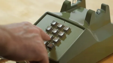 Man dialing retro push button rotary dial telephone. Stock Footage 119042977