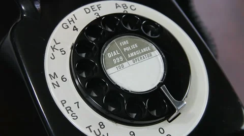 Man dialling figures 1 through 9 on old rotary dial UK telephone close up Video stock 46283464