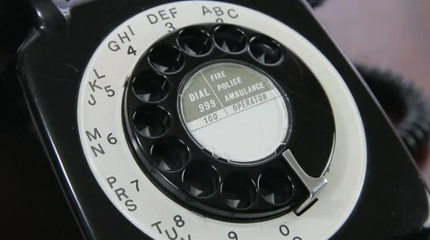 Man dialling six random digits on old rotary dial UK telephone close up Video stock 46282956