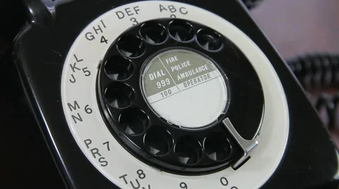 Man dialling ten random digits on old rotary dial UK telephone close up Video stock 46282998