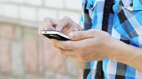Man Dials SMS On Your Mobile Phone Stock Footage 64290930