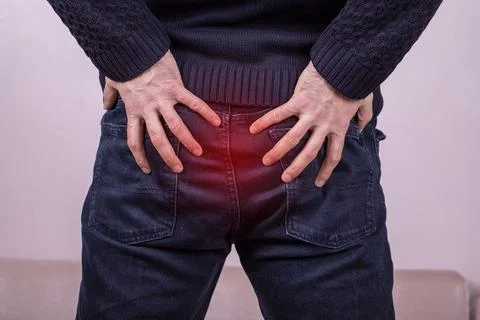 Man with diarrhea problem, man with digestive problem touching his buttock, m Stock Photos