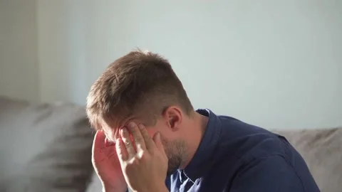 A man in a difficult situation, thinks how to solve the problem 動画素材 168983667