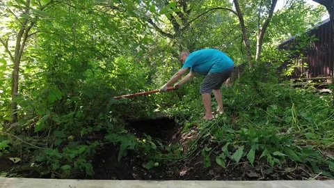 Man dig and build drainage ditch of septic tank of the sewer Stock Footage 305237335