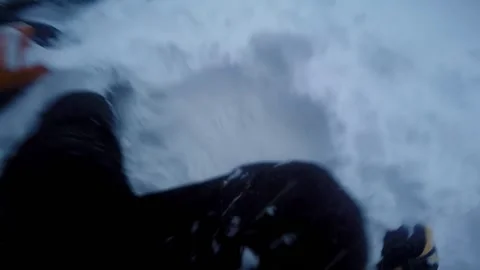 Man dig up snowmobile using his legs Video stock 102161177