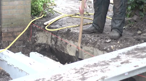 Man digging builing foundation Stock Footage 34522231