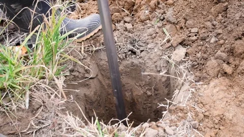 Man digging earth with a shovel Stock Footage 300897071