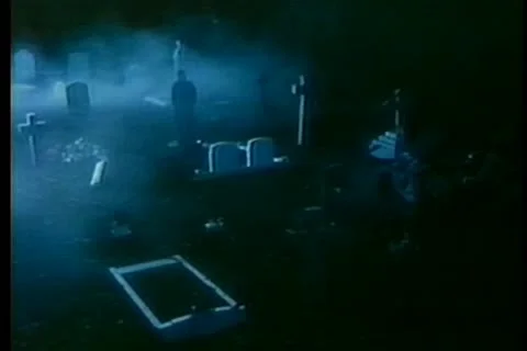 Man digging grave at night Stock Footage 11350234