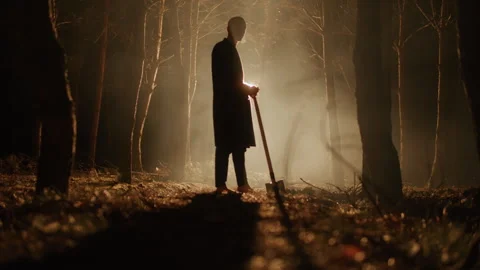 Man Digging a Grave with a Shovel in the forest Stock Footage 259122987