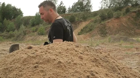 Man digging a hole with a shovel. Close-up. Stock Footage 58180205