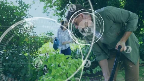 Man digging shovel while woman holding can, motion sending tech HUD overlays for Stock Footage 331713259