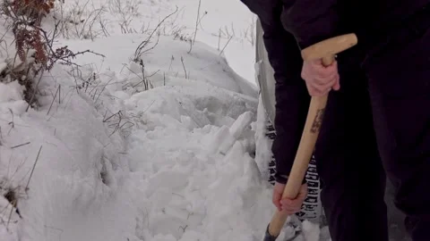 Man digging snow with shovel near car Stock Footage 242153953