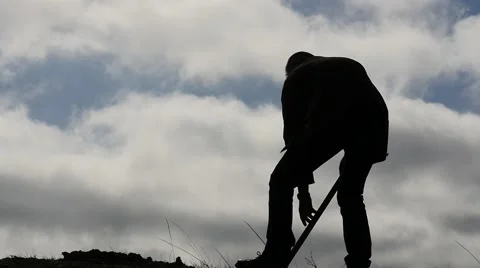 Man digging with the spade and wipes the sweat slow motion 2 Видео 47600076